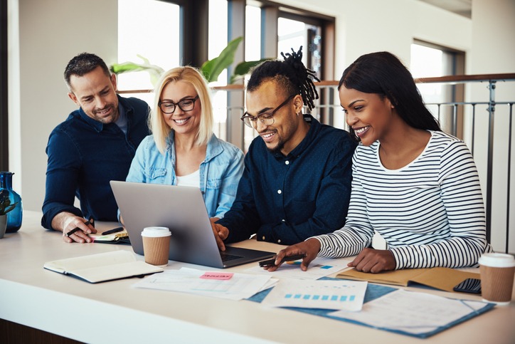 Diverse group of colleagues working together at an office table