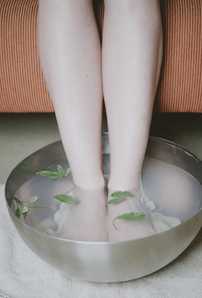 feet in a basin of water