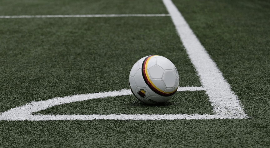 Image of football on pitch.