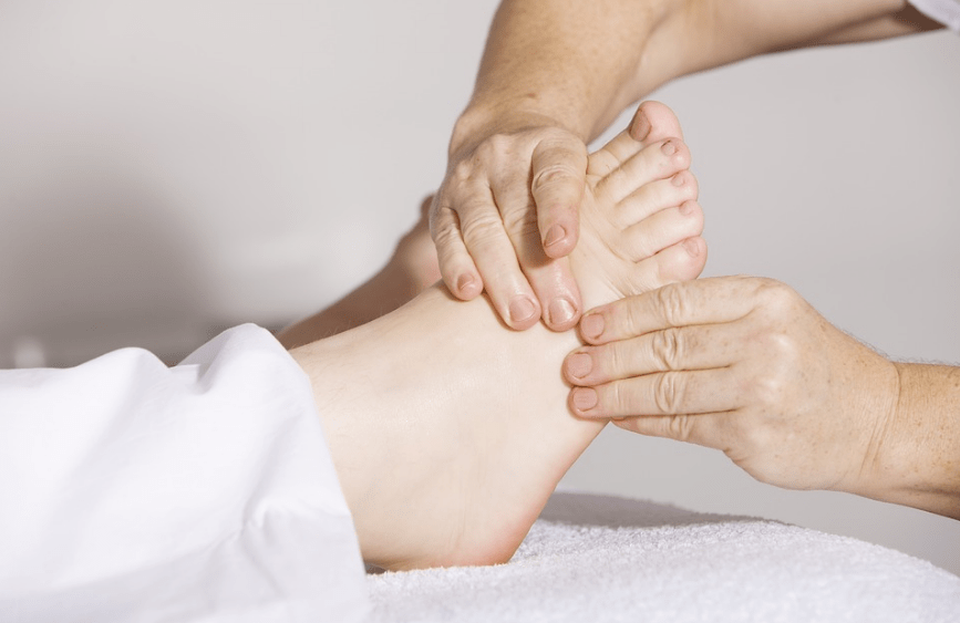 feet being massaged