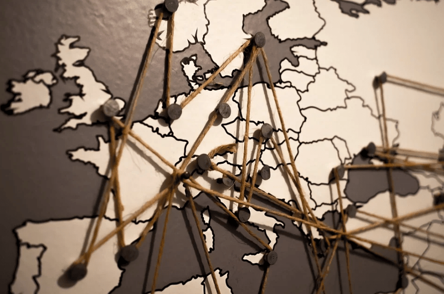map of Europe, a network of brown strings, pins