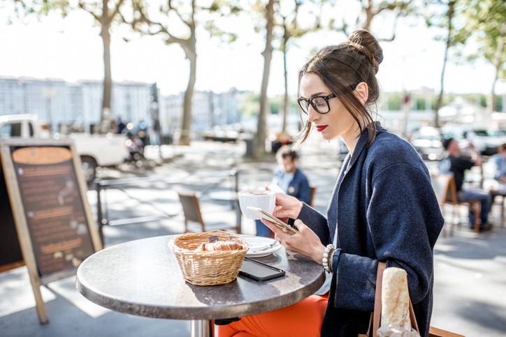 Woman sitting at the cafe outdoors