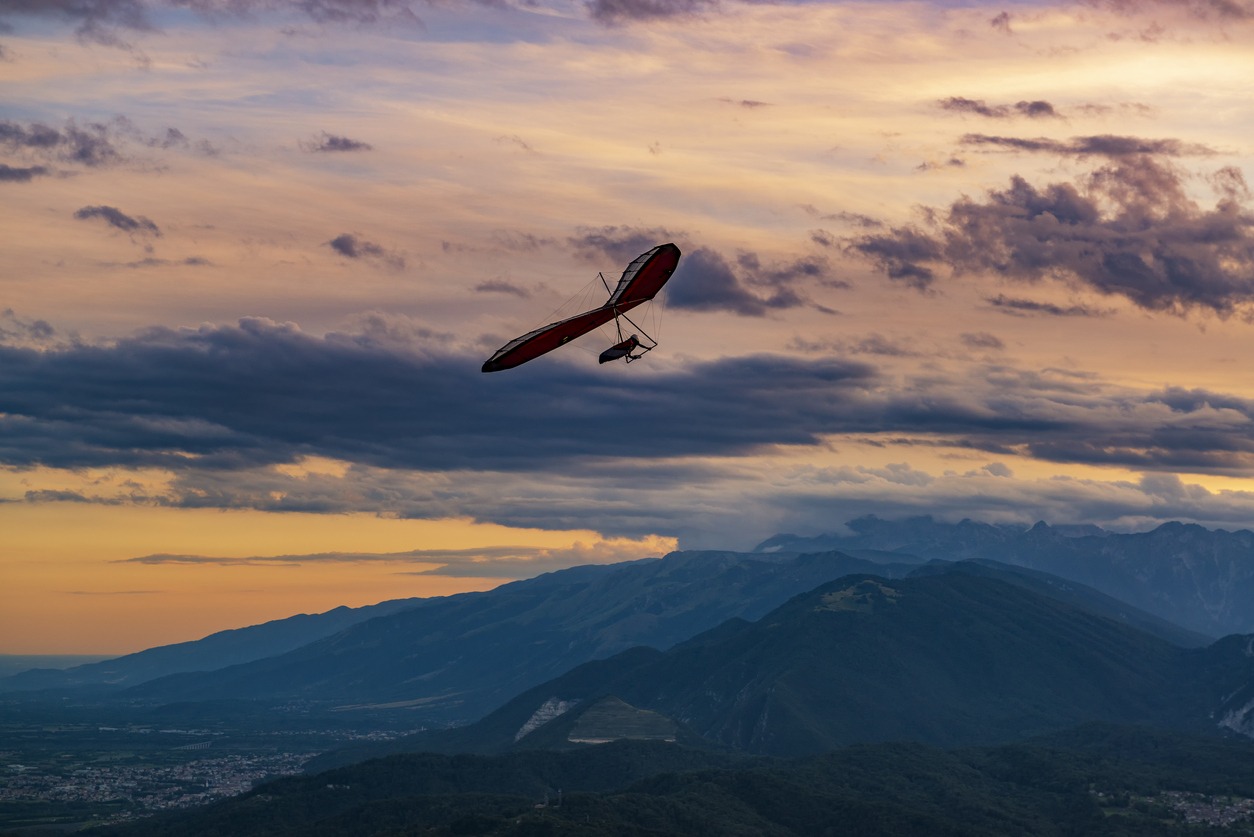 A glider shown at sunset