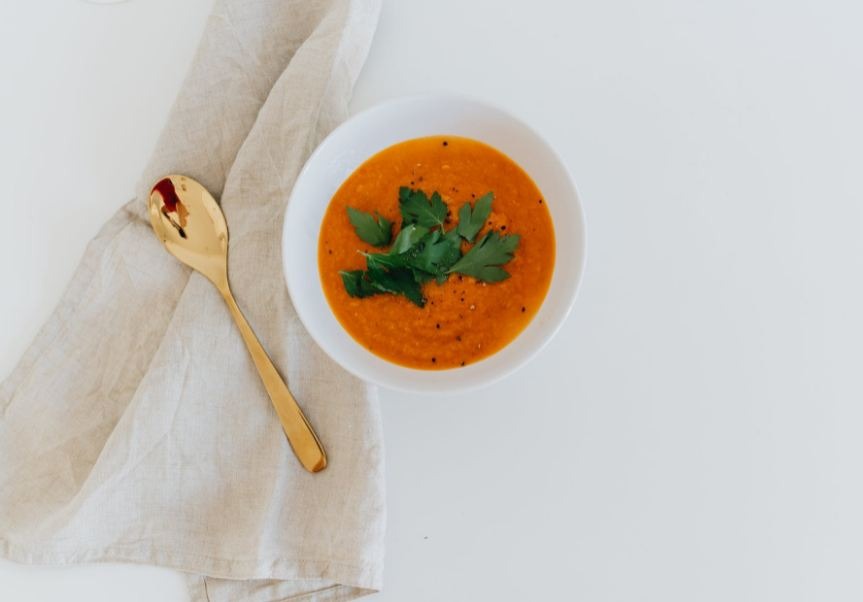 A photo of an orange soup