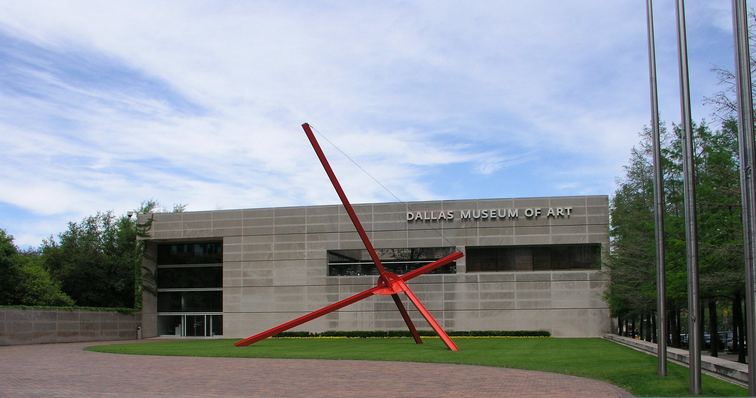 Dallas Museum of Art, red artwork in the garden, green trees