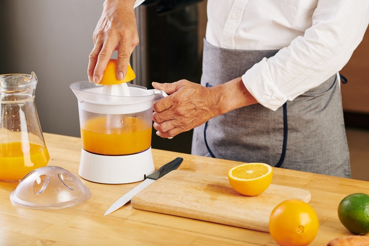 Man making orange juice