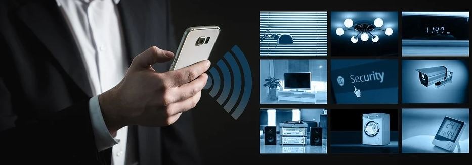 man holding his smartphone to control home security system