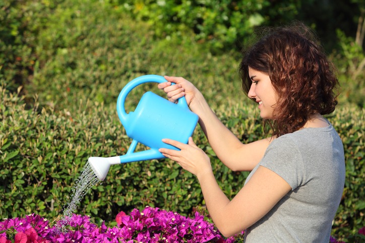 Beautiful woman with a watering
