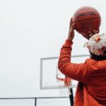 a player holding a basketball ball